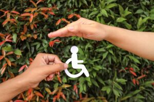 Hands Holding And Protecting Disability Icon Paper